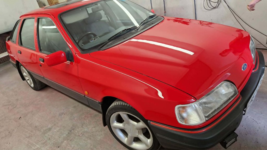 Porsche 944 in spray booth during respray preparation