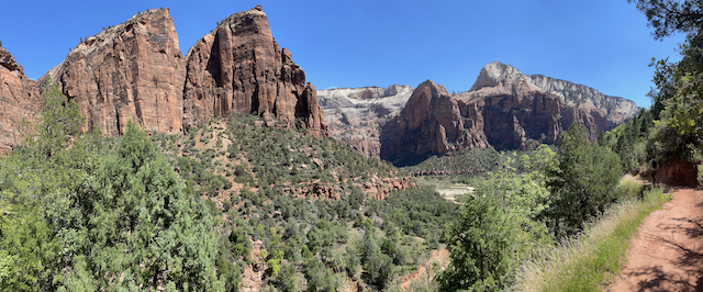 Panoramic view of Zion canyon walls and valley from the trail