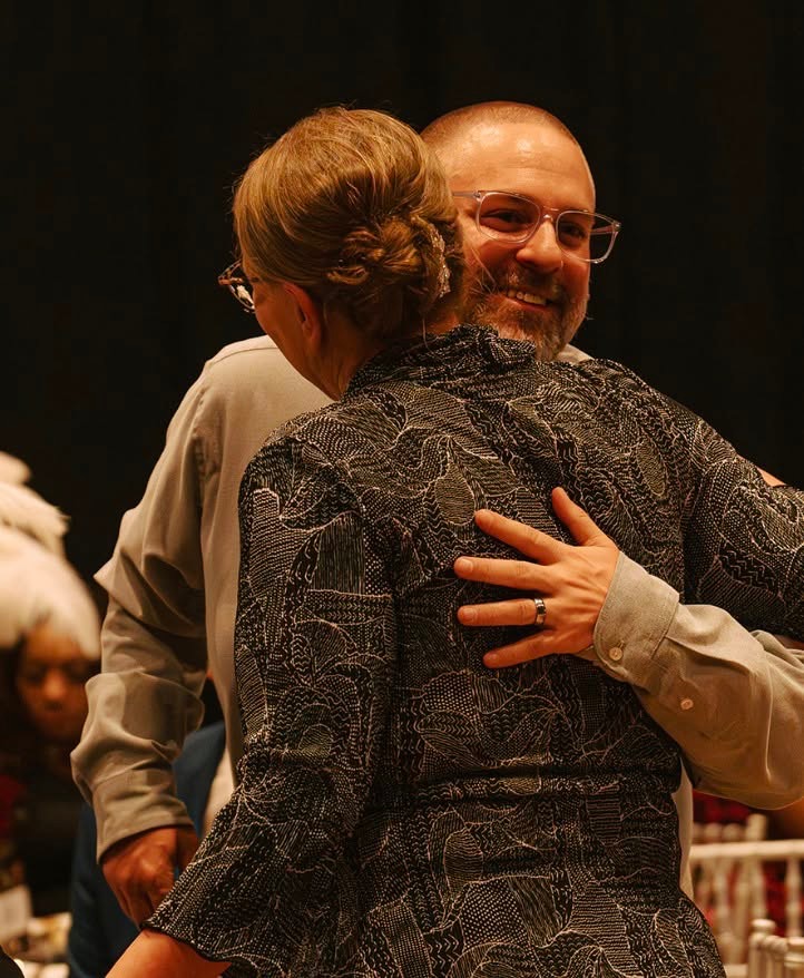 Embrace between guests