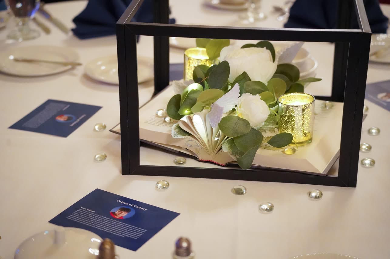 Table centerpiece and Voices of Victory program card