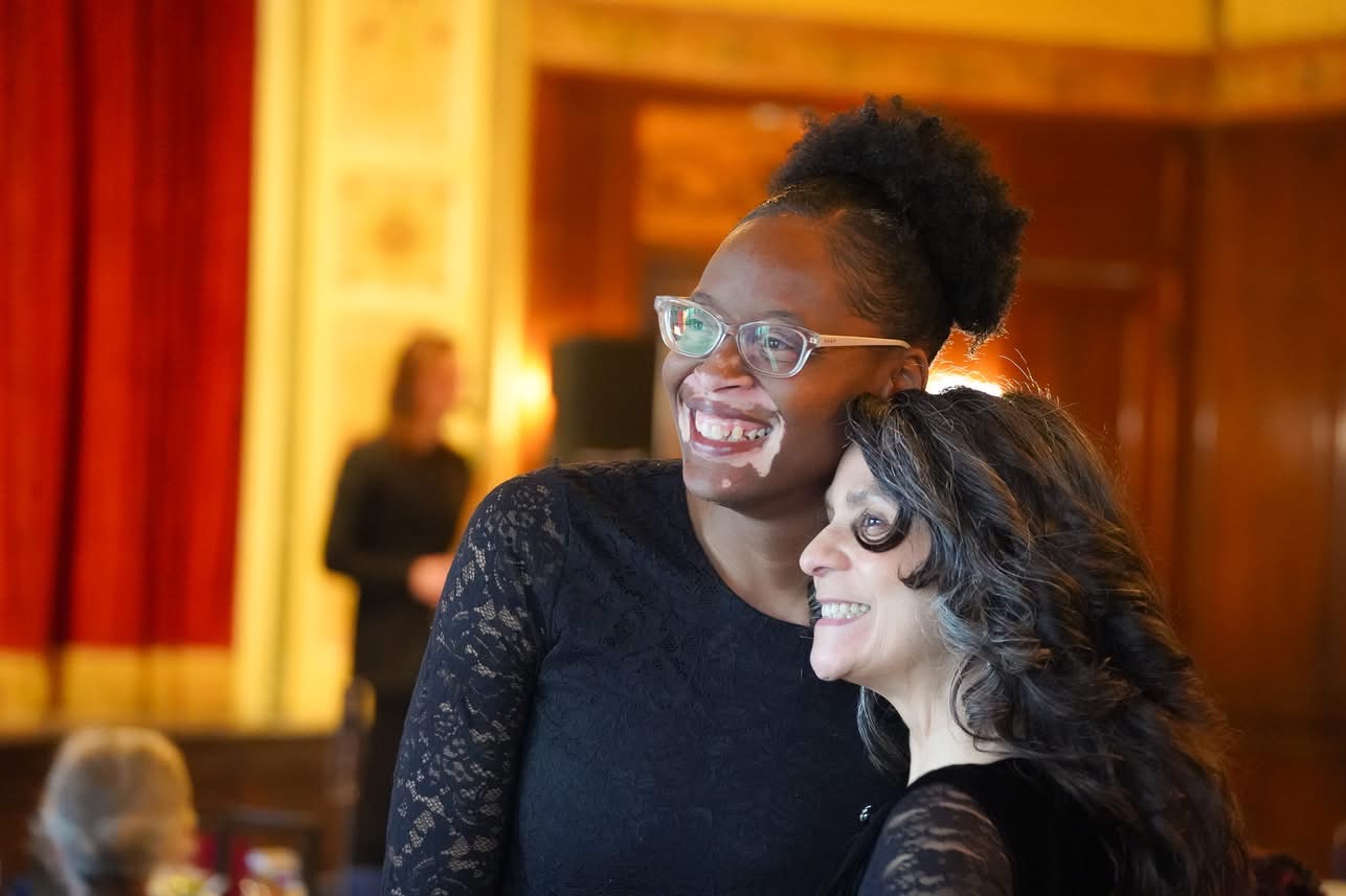 Two women smiling together