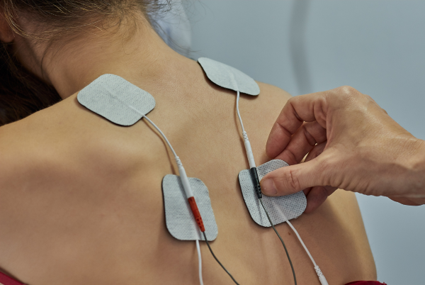 Electric muscle stimulation therapy being applied to a patient's back