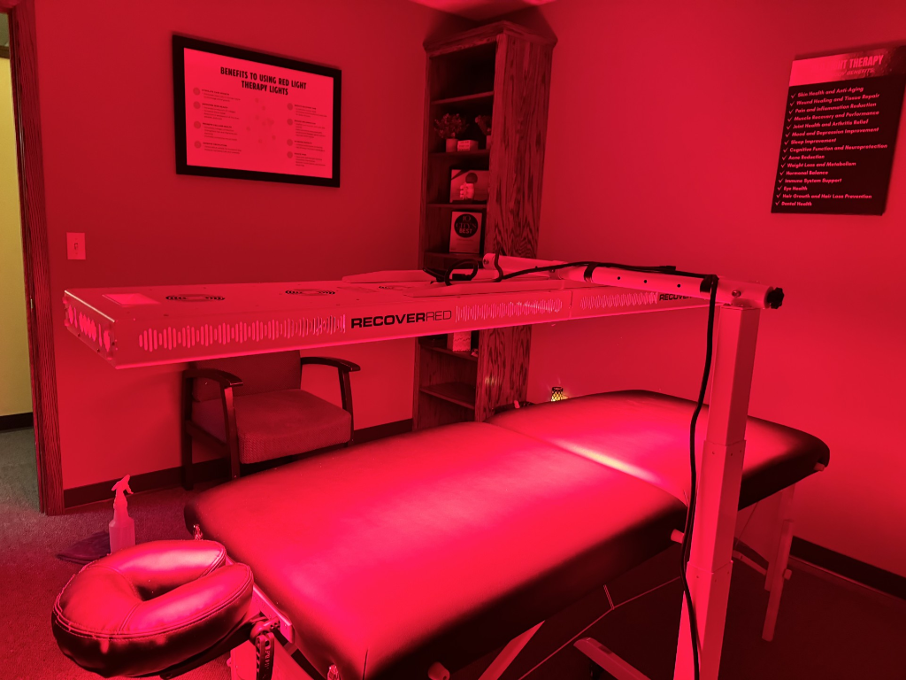 Patient using the NovoTHOR red light therapy pod at Wheat Chiropractic