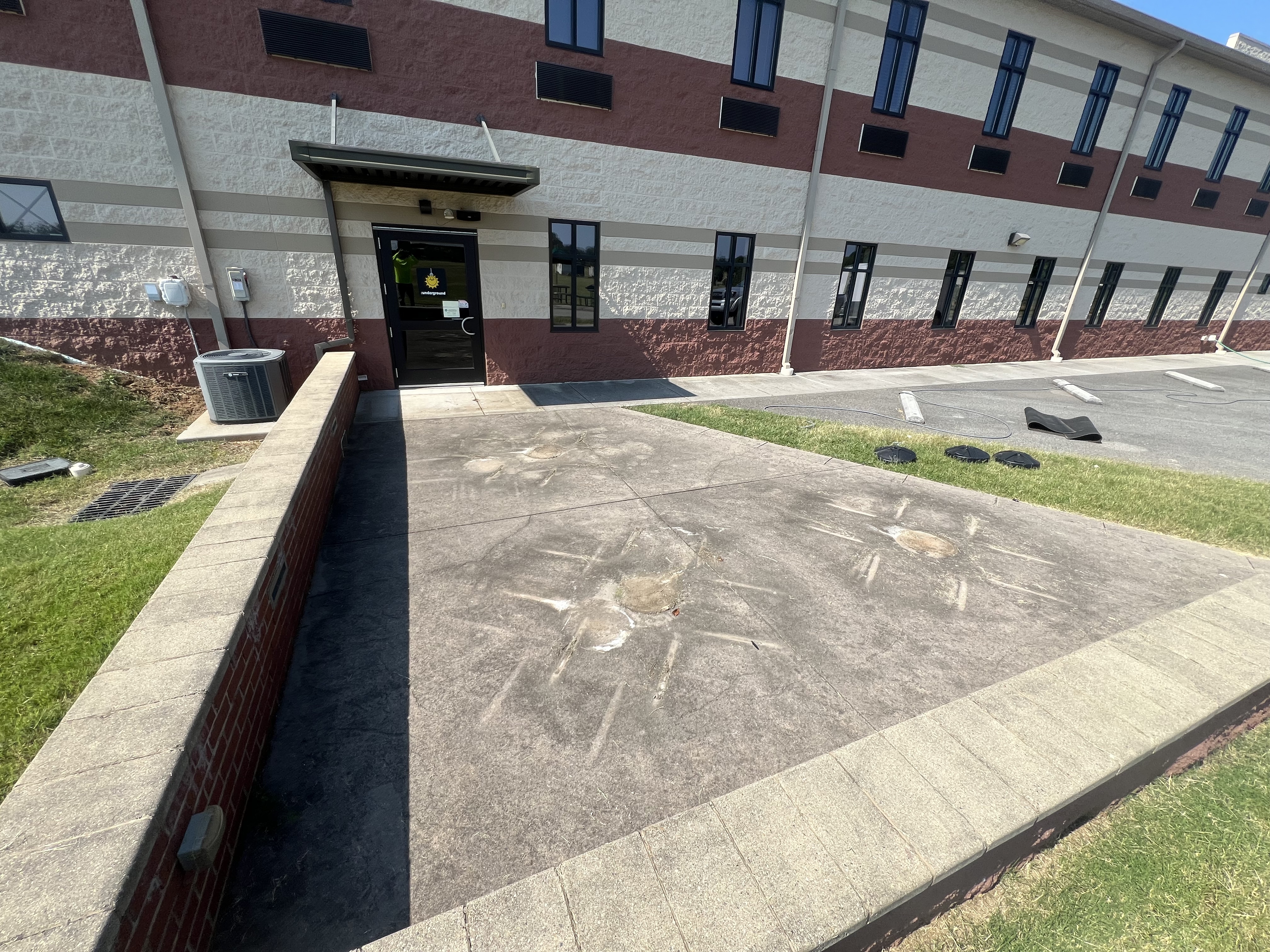 Why Your Concrete Turns Black — Driveways, Sidewalks, and Hardscapes