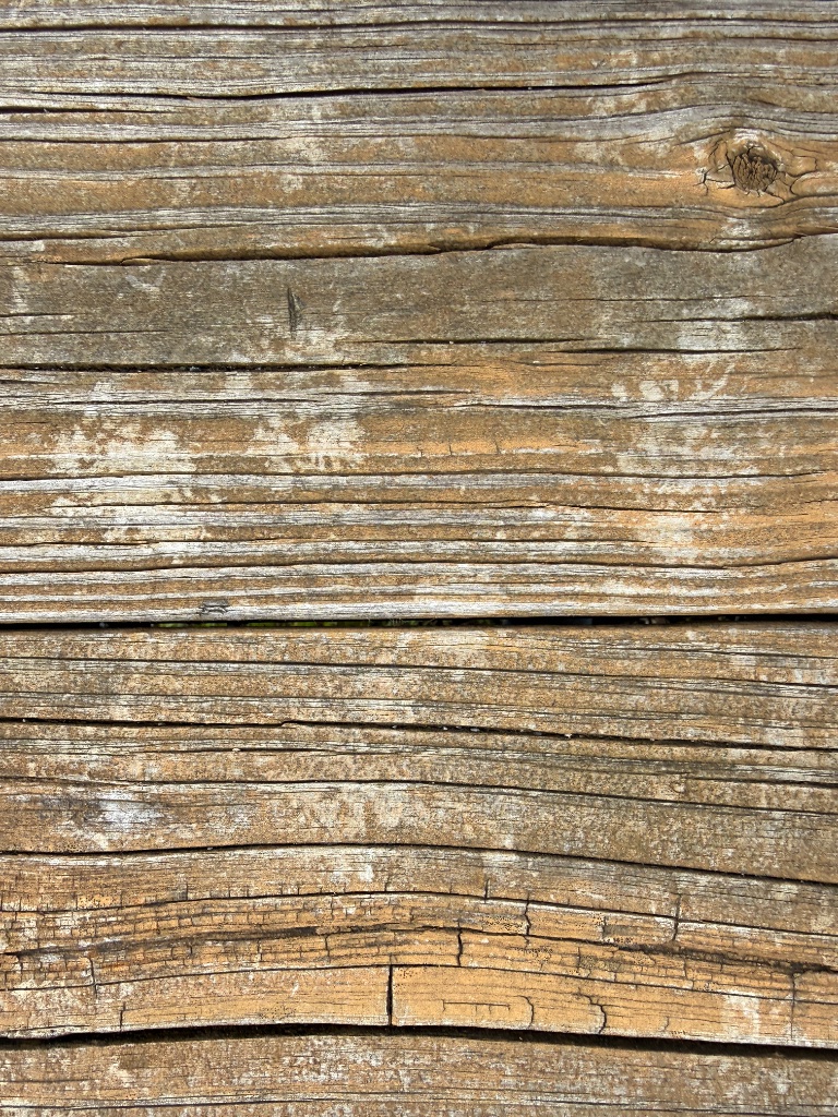 Weathered and cracked wood siding