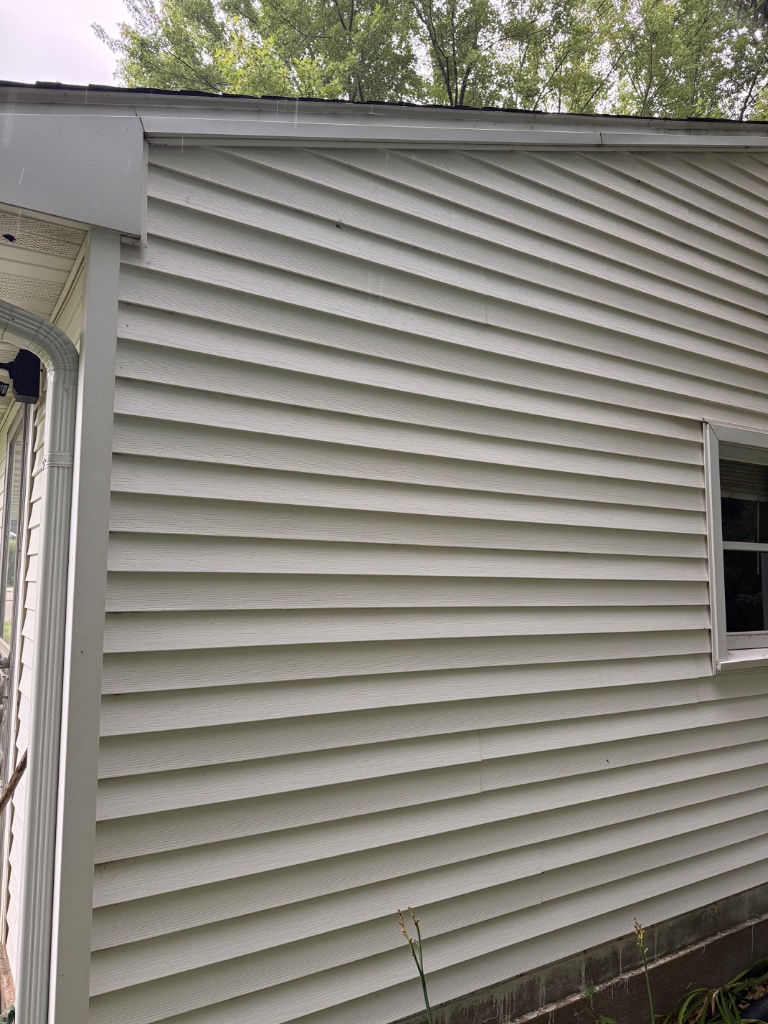 Clean vinyl siding after pressure washing