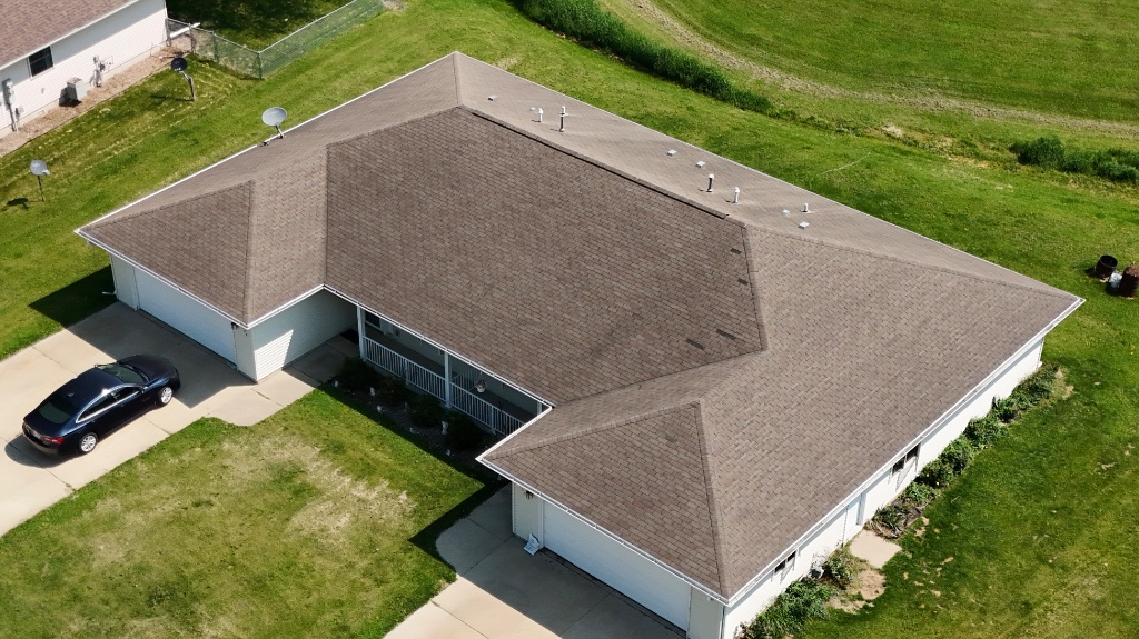 Before — aged shingles ready for replacement