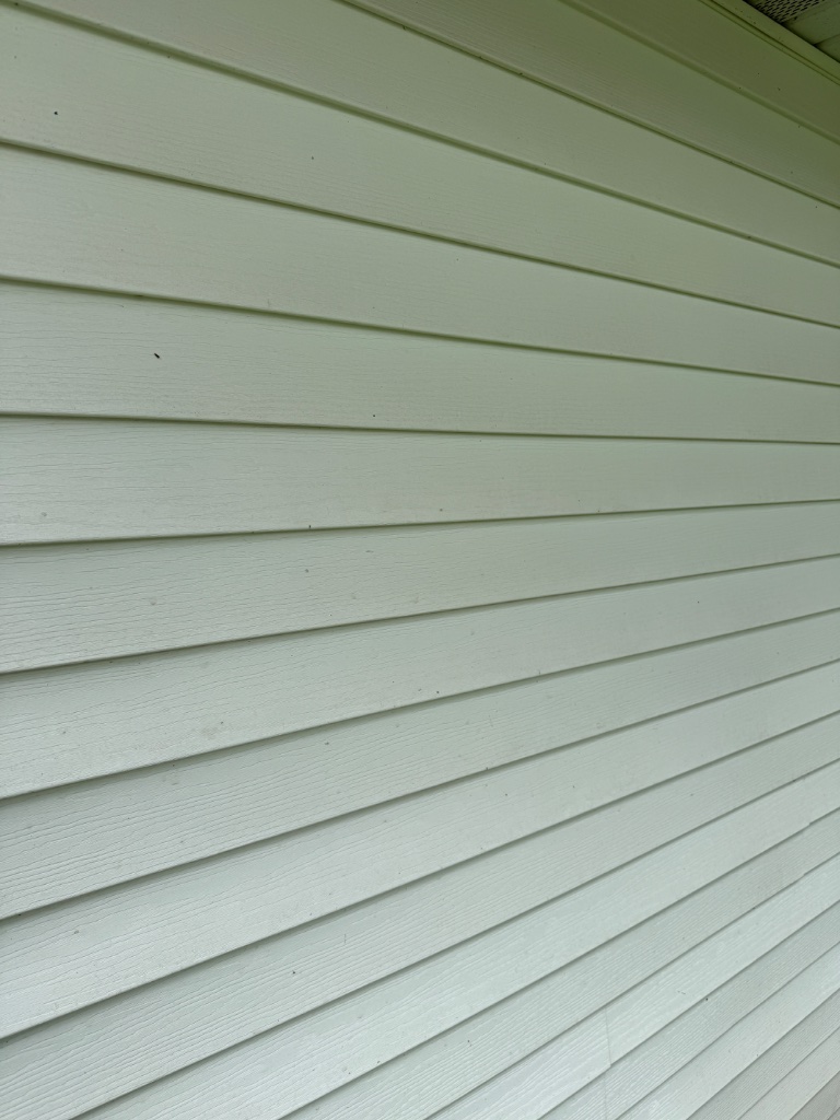 Clean siding after pressure washing