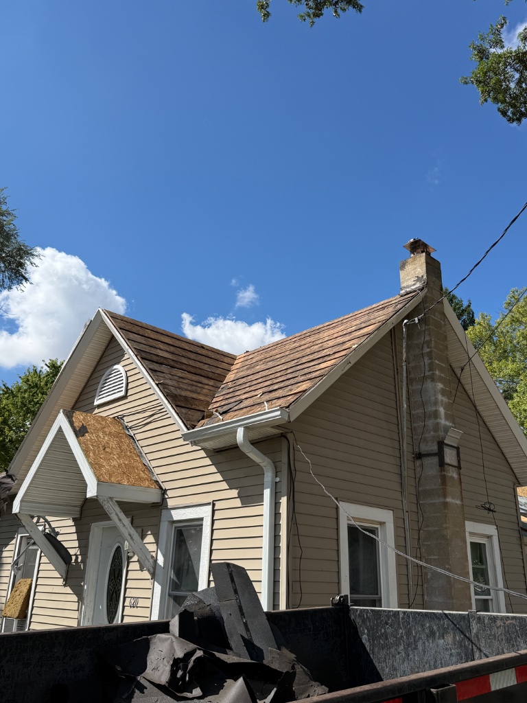 Old shingles stripped — ready for new decking