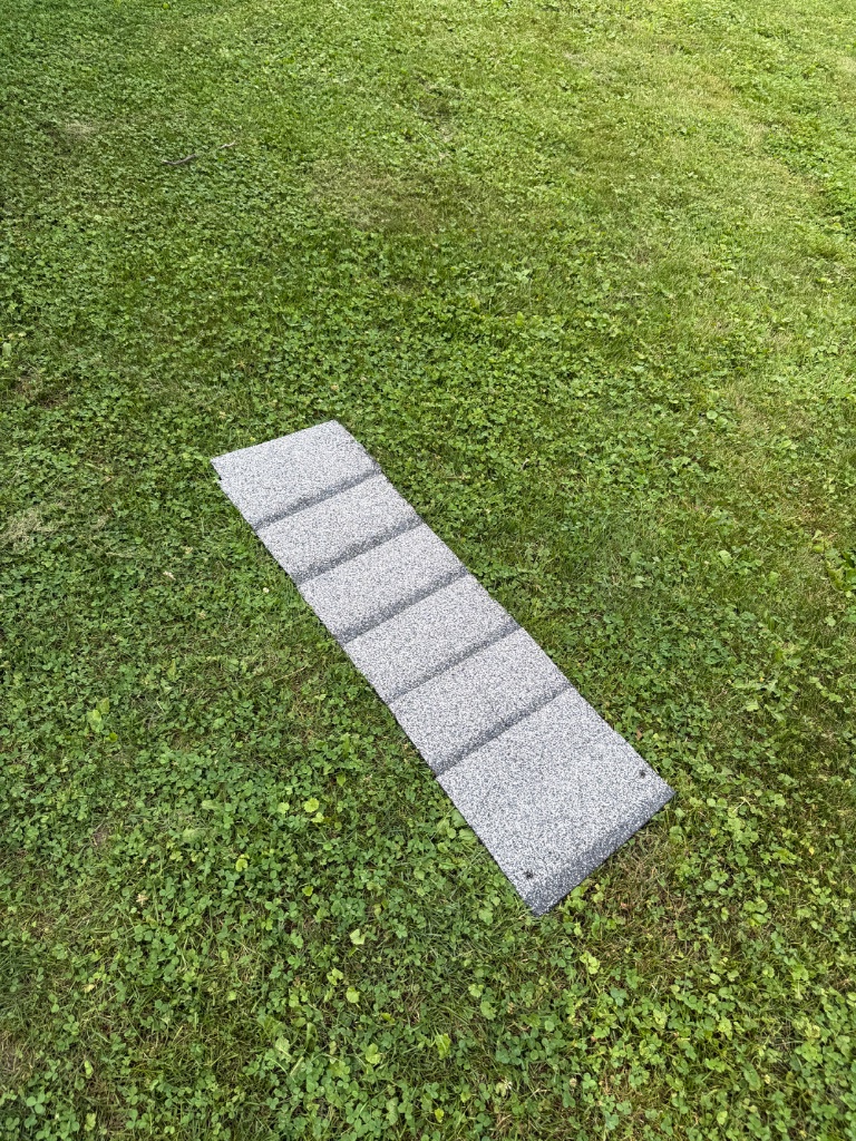 Removed damaged ridge cap shingle