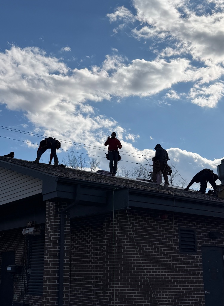 Hookset roofing crew on the job
