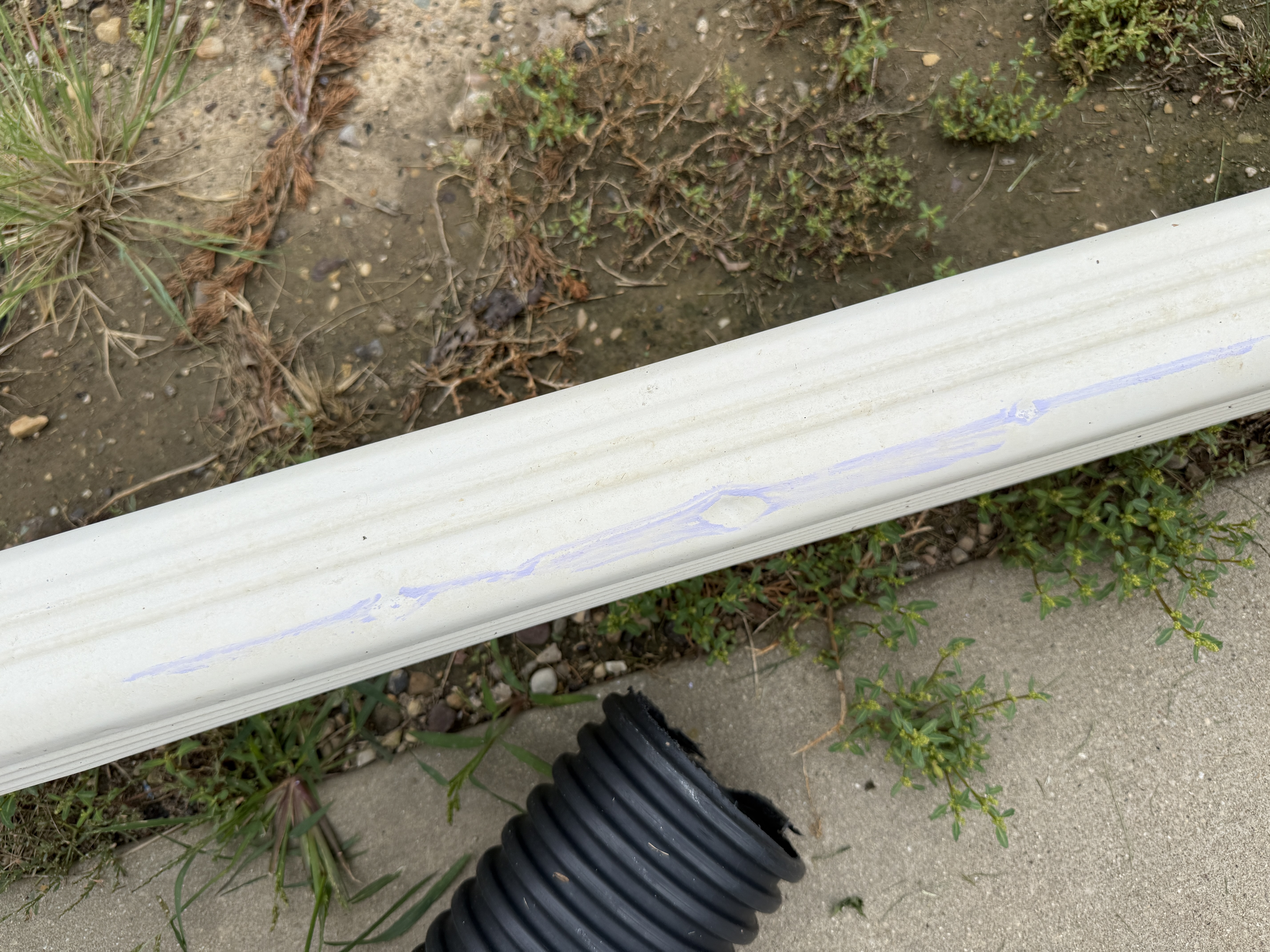 Downspout extension with marking residue