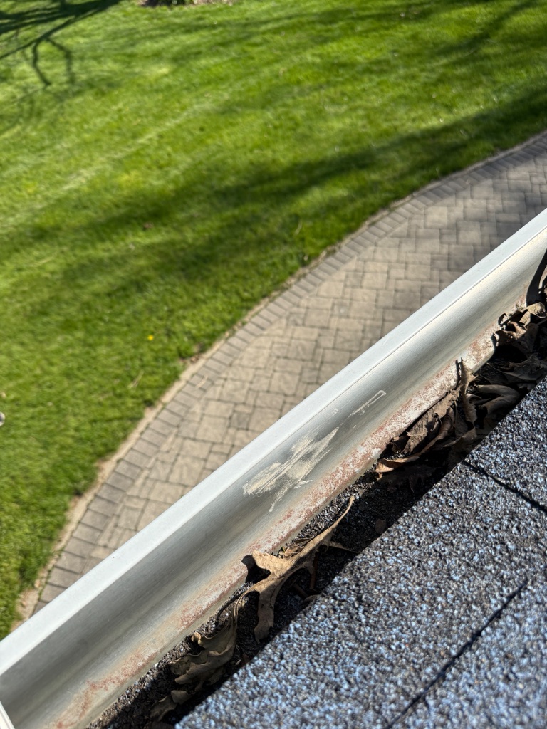 Debris-filled gutters after storm