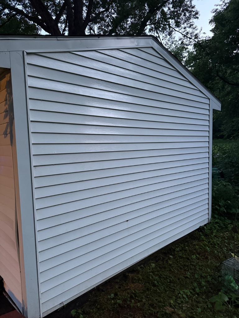 Shed gable clean after pressure washing