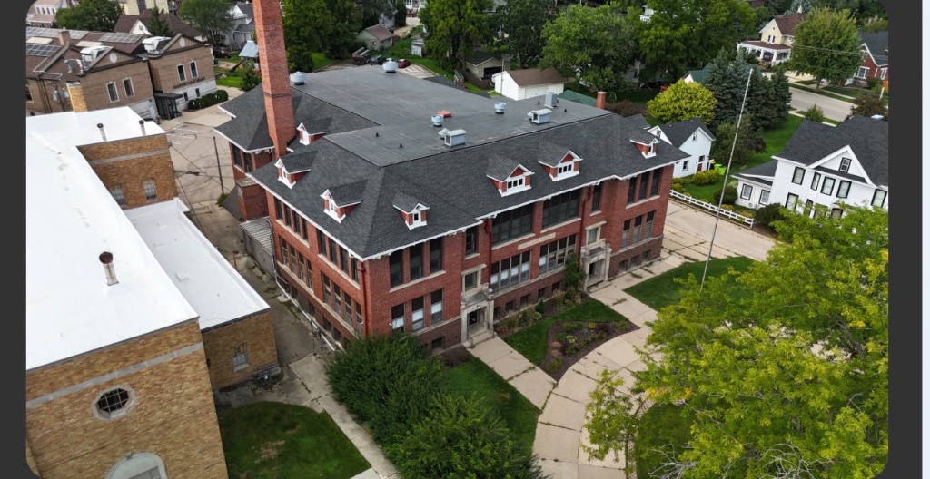 Drone aerial view of multi-story building roof