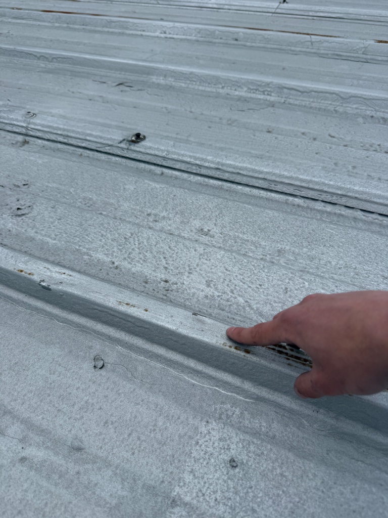 Close-up hail hits on asphalt shingles