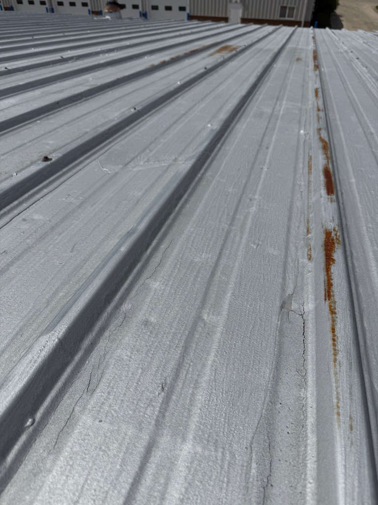 Hail dents on metal roofing panel