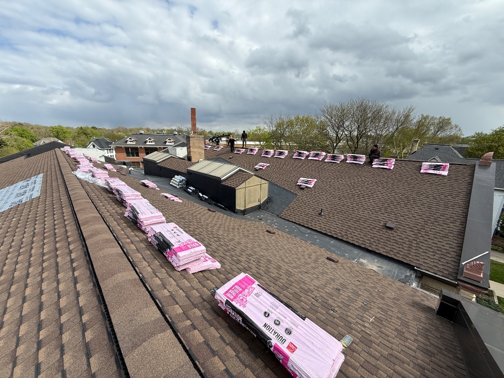 Active job site — shingles staged and ready for installation