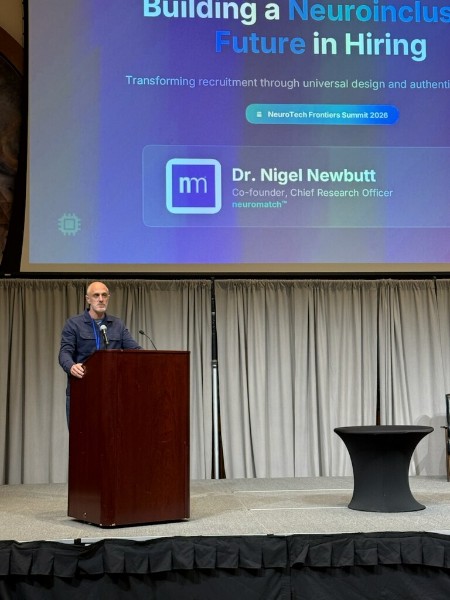 Dr. Nigel Newbutt presenting “Building a Neuroinclusive Future in Hiring” on the main stage