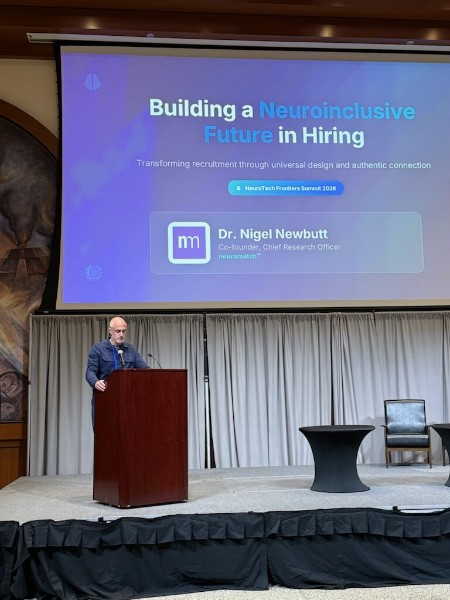 Dr. Nigel Newbutt presenting “Building a Neuroinclusive Future in Hiring” — as seen from the hall