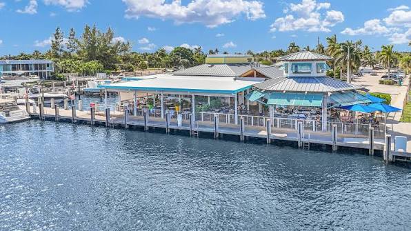 The Cove Waterfront Restaurant and Tiki Bar with outdoor waterfront seating and docks in Deerfield Beach