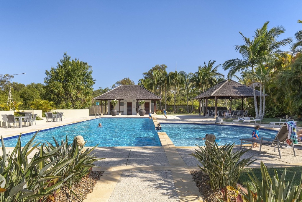 Resort residence — resort pool with Balinese pavilions and tropical gardens