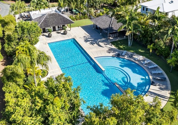 Resort residence — aerial view of resort pool and Balinese pavilions
