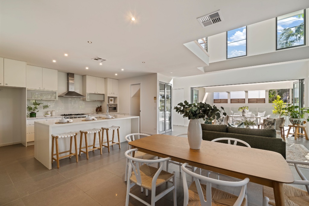 Resort residence — gourmet kitchen with stone island and dining