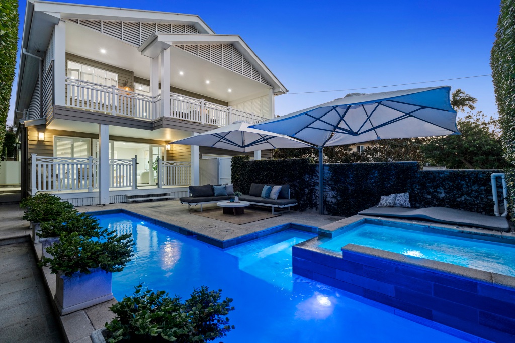Stratton Terrace — rear facade with pool and spa at twilight