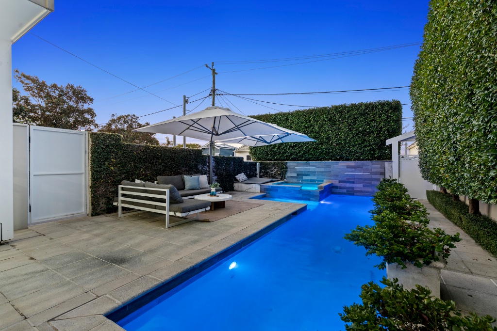 Stratton Terrace — pool and entertaining area at dusk