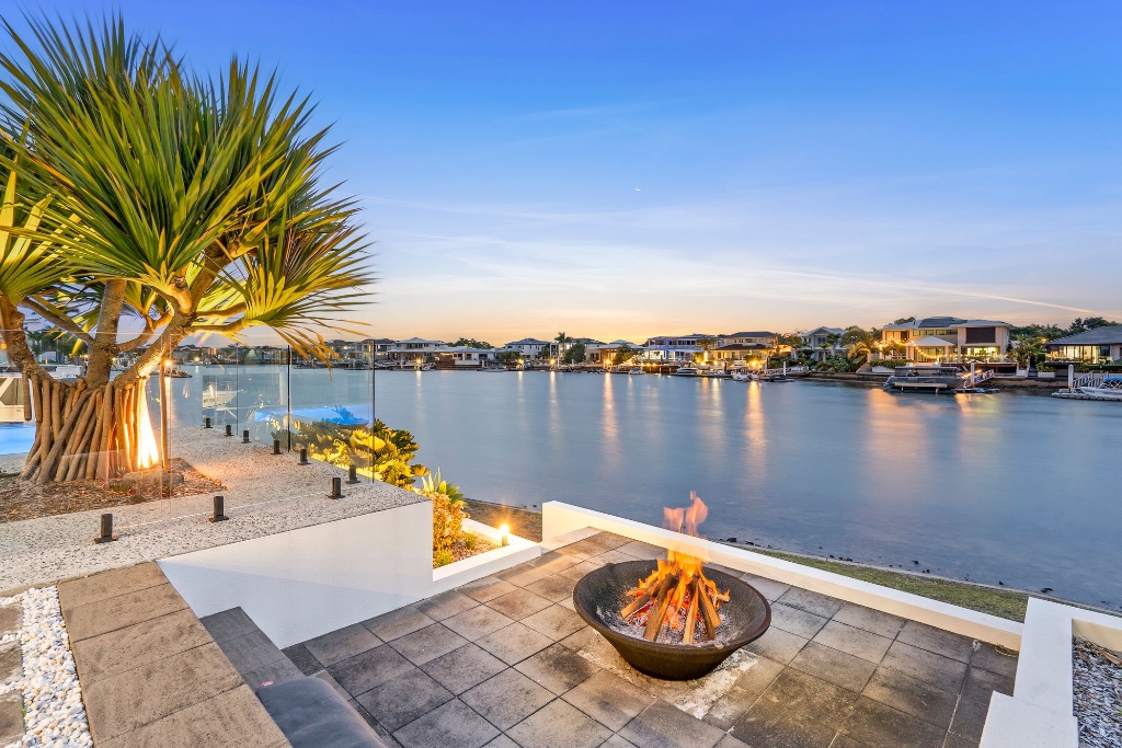 Waterfront estate — fire pit terrace at dusk