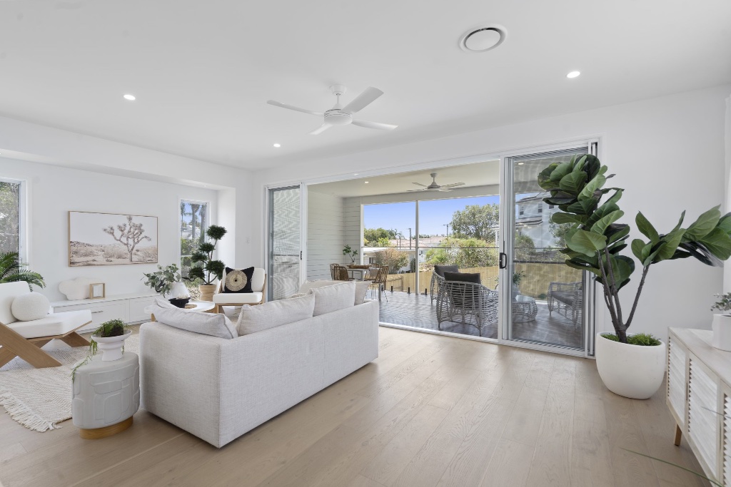 Watson Street — living room with timber floors and alfresco access