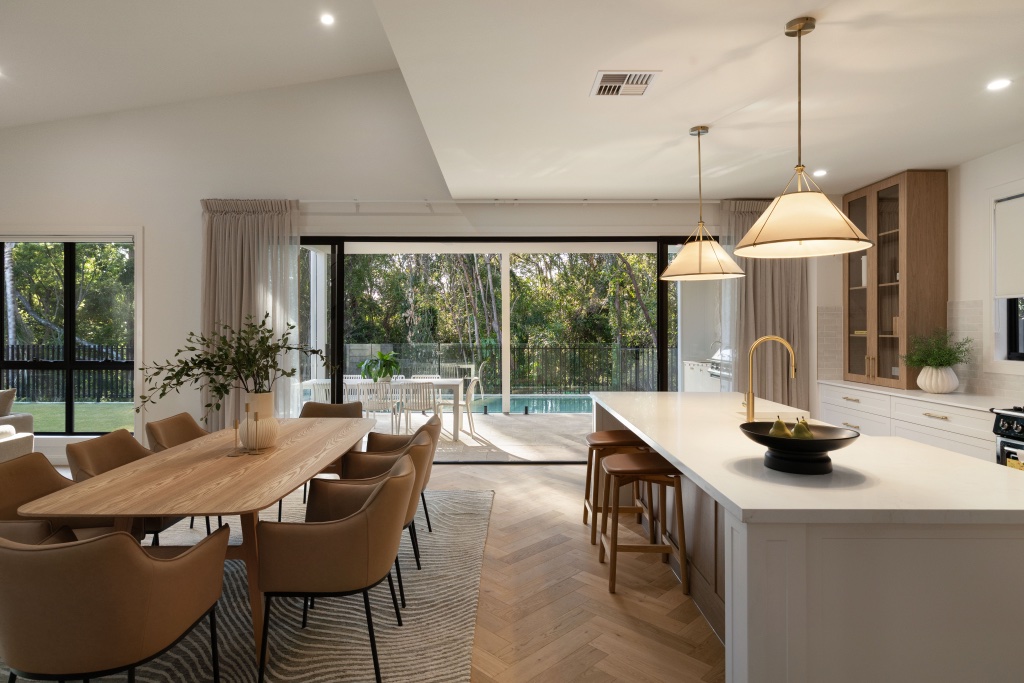 Queensland indoor-outdoor living — kitchen and dining open to pool