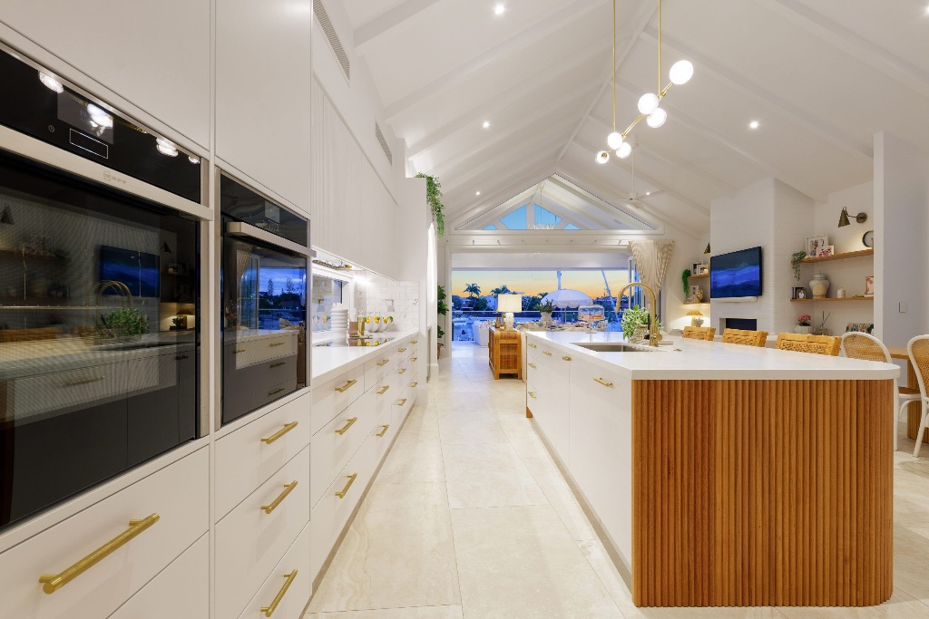 Seahaven Court — gourmet white kitchen with fluted timber island and gold fittings