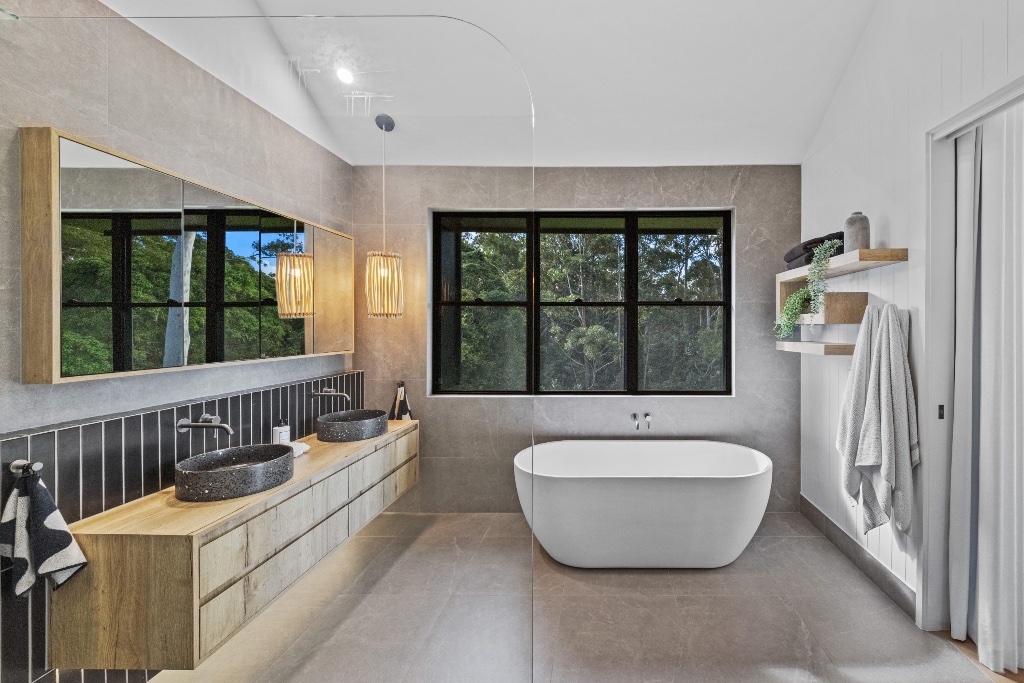 Tinbeerwah Road — lounge with stone wall and fireplace