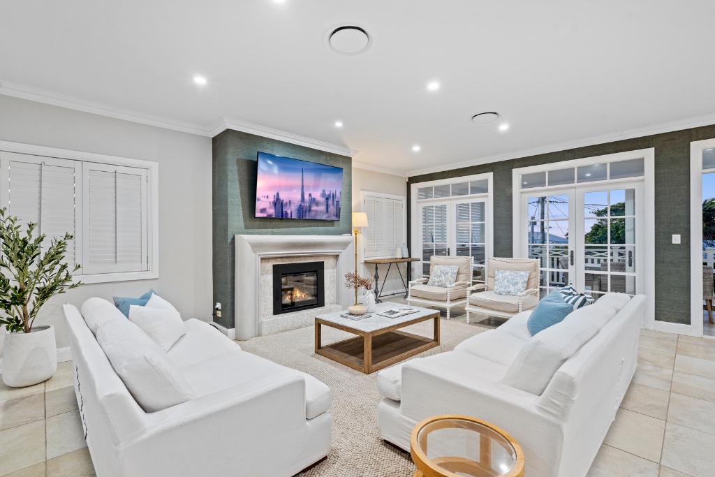 Stratton Terrace — formal lounge with fireplace and balcony access
