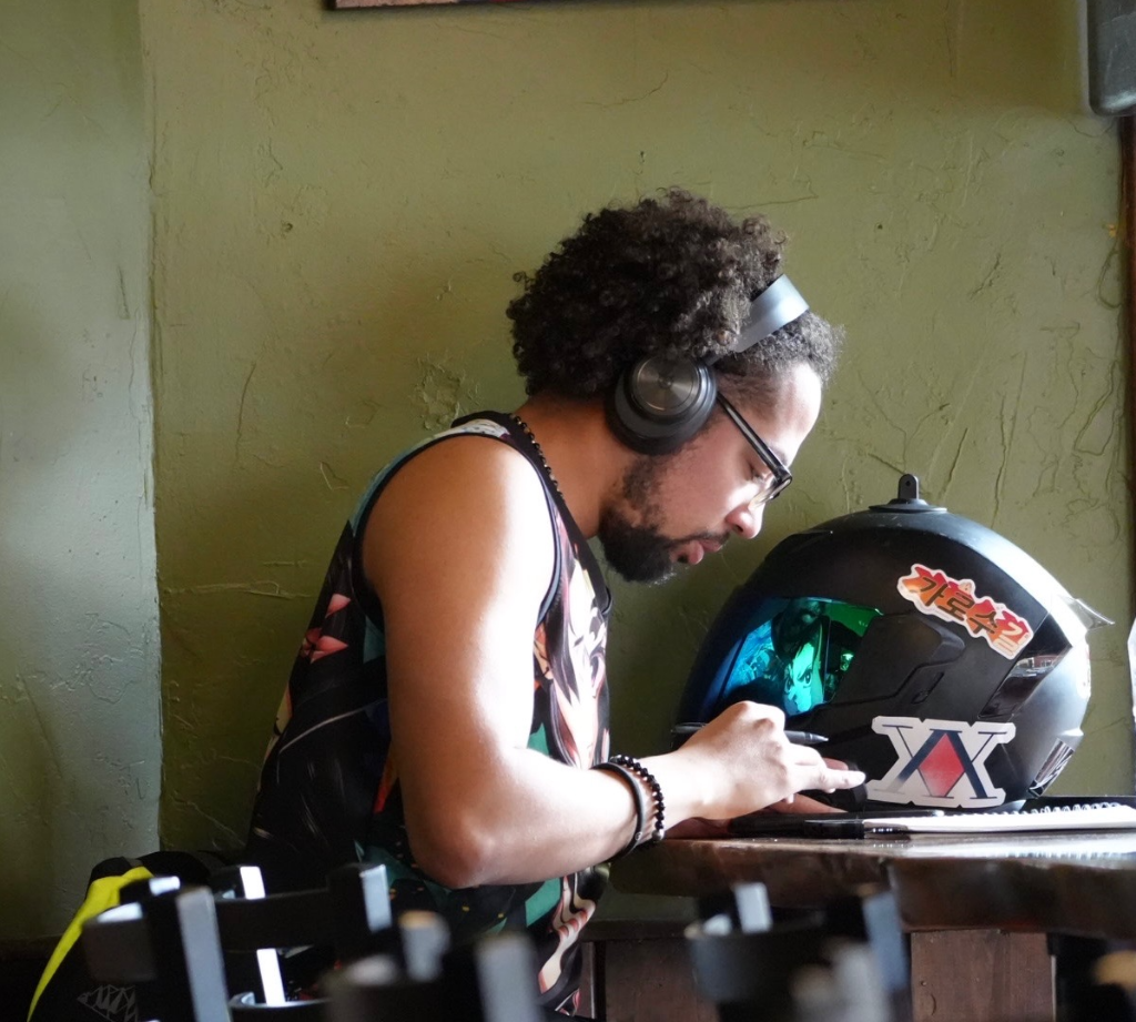 Behind-the-scenes content creation — creator at workspace