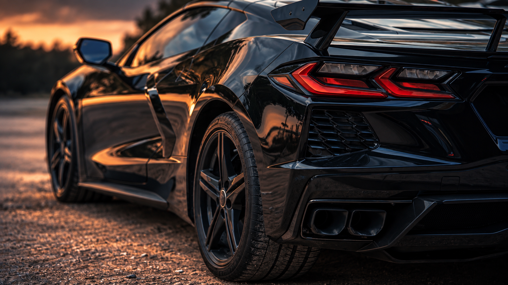 Cinematic automotive photography — black C8 Corvette rear-quarter at sunset, Just Because 22