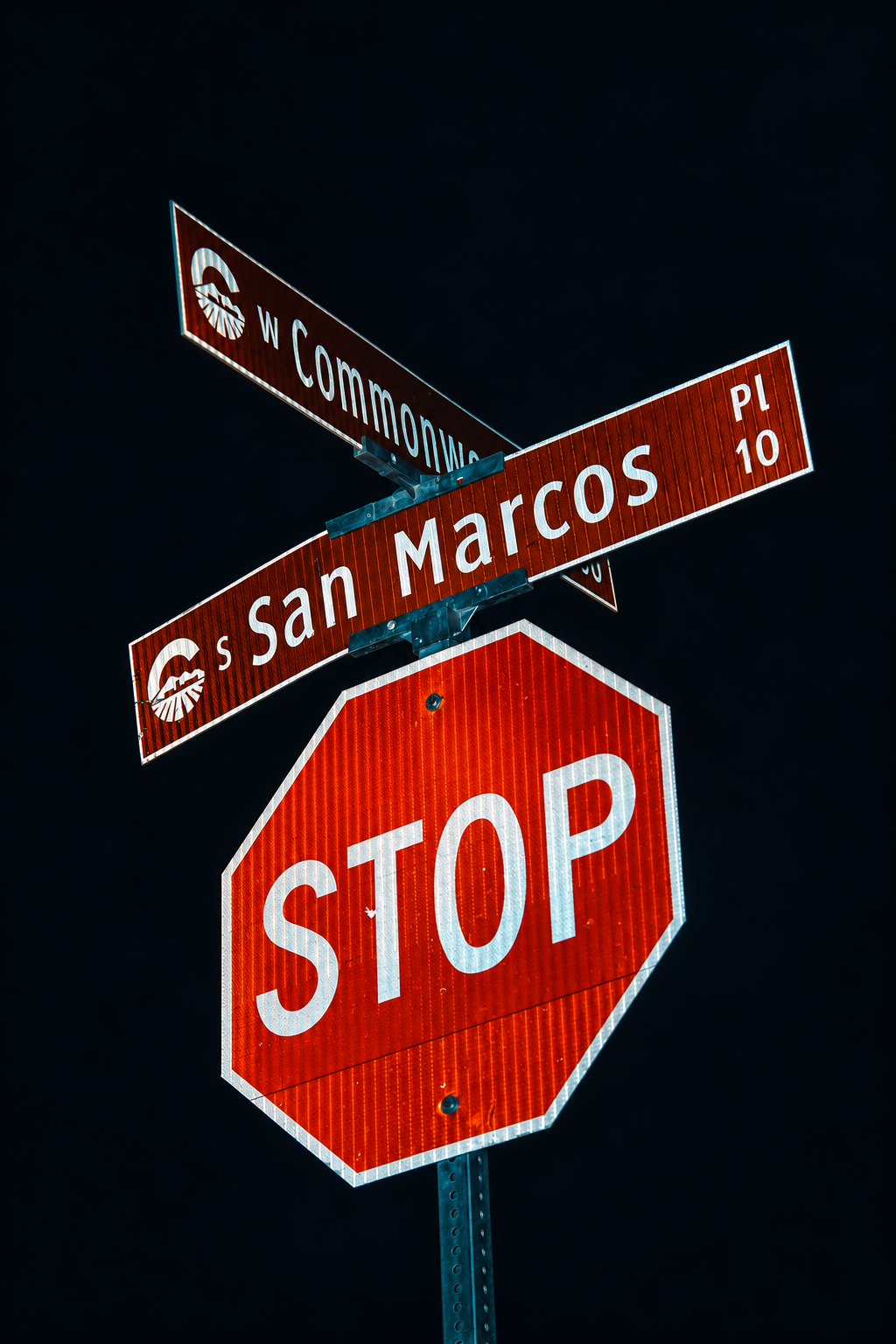Street signs and a STOP sign against a dark background — Chandler, Arizona