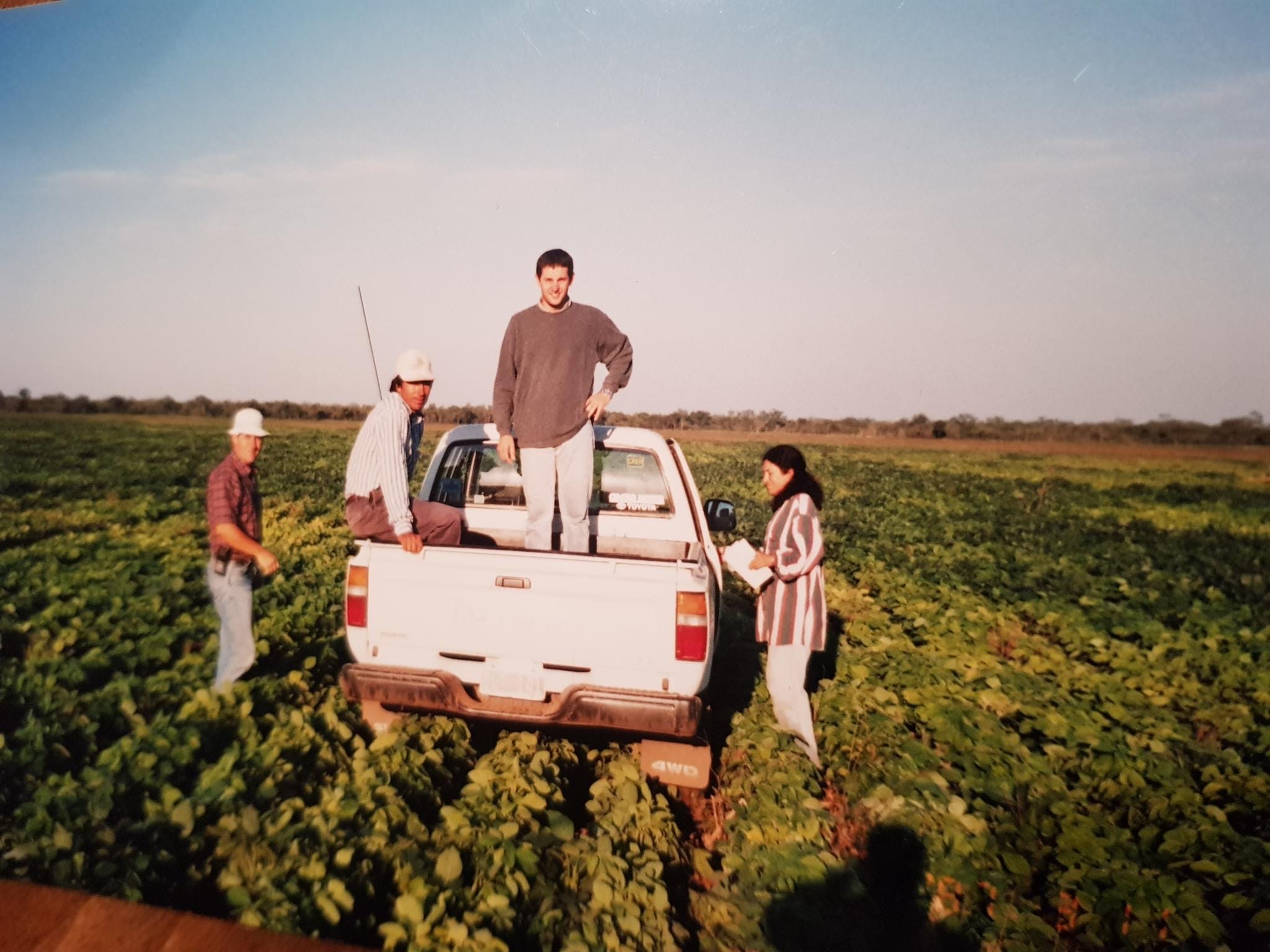 Cono Group historical photo — team in the field with pickup truck