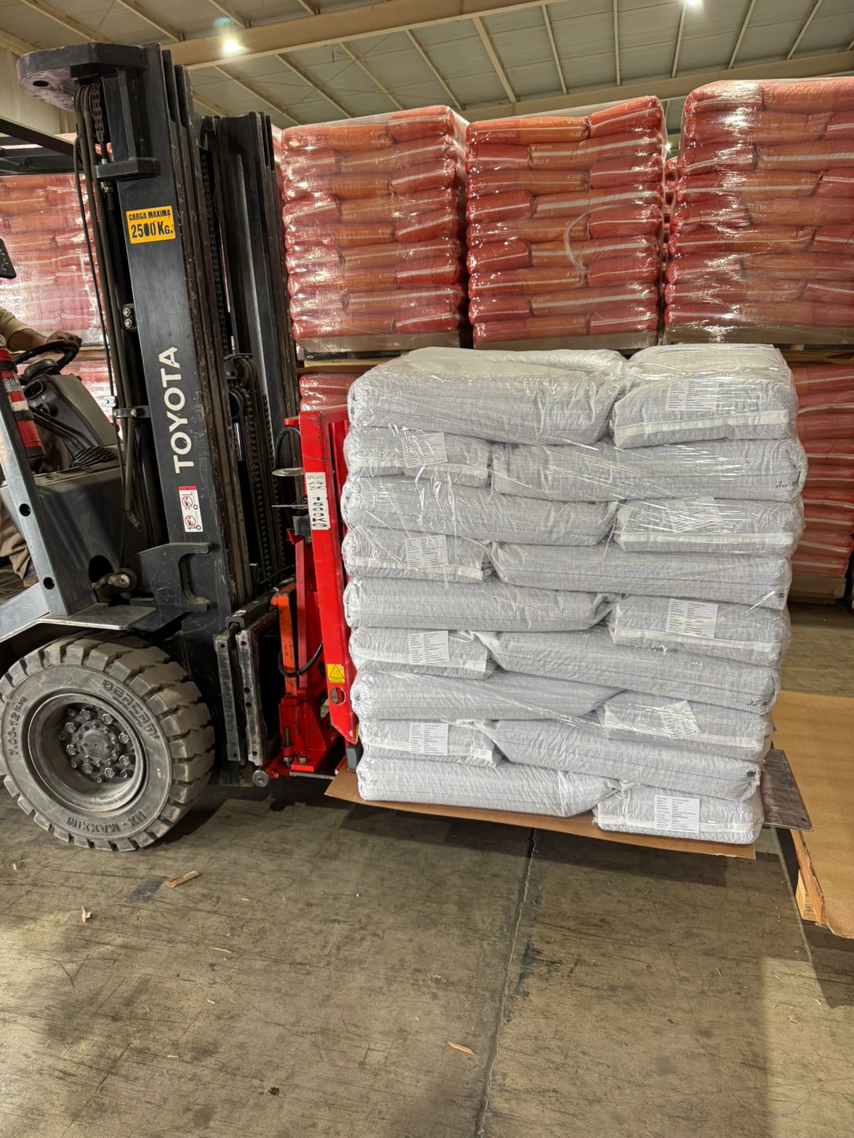 Forklift handling palletised packaging at the plant