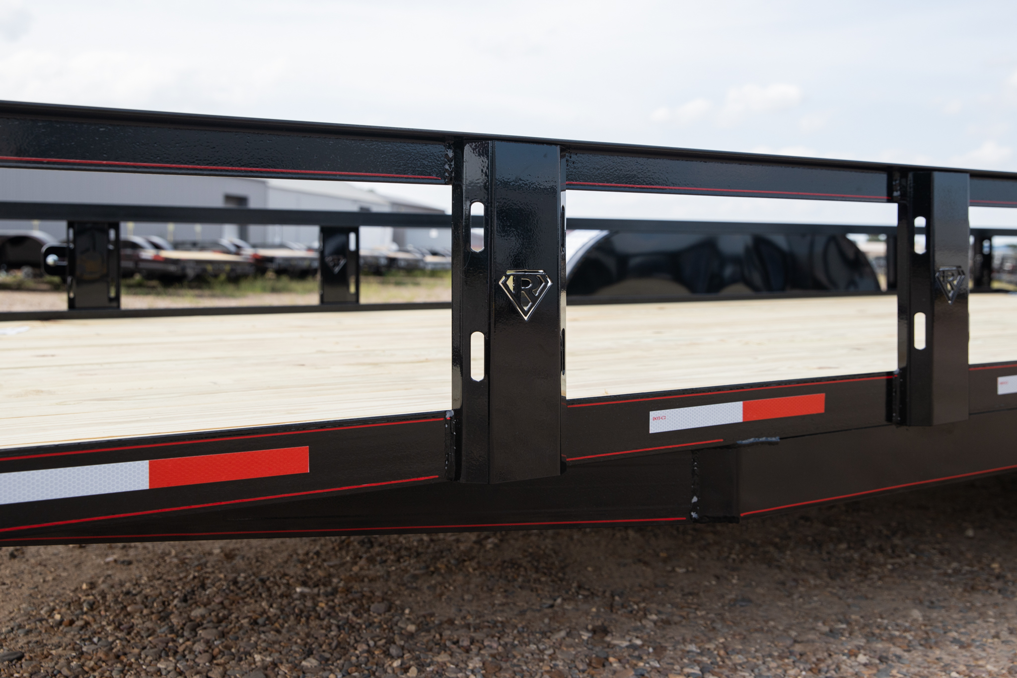 Close view of the new thicker, wider Retco upright integrated into a utility trailer side rail