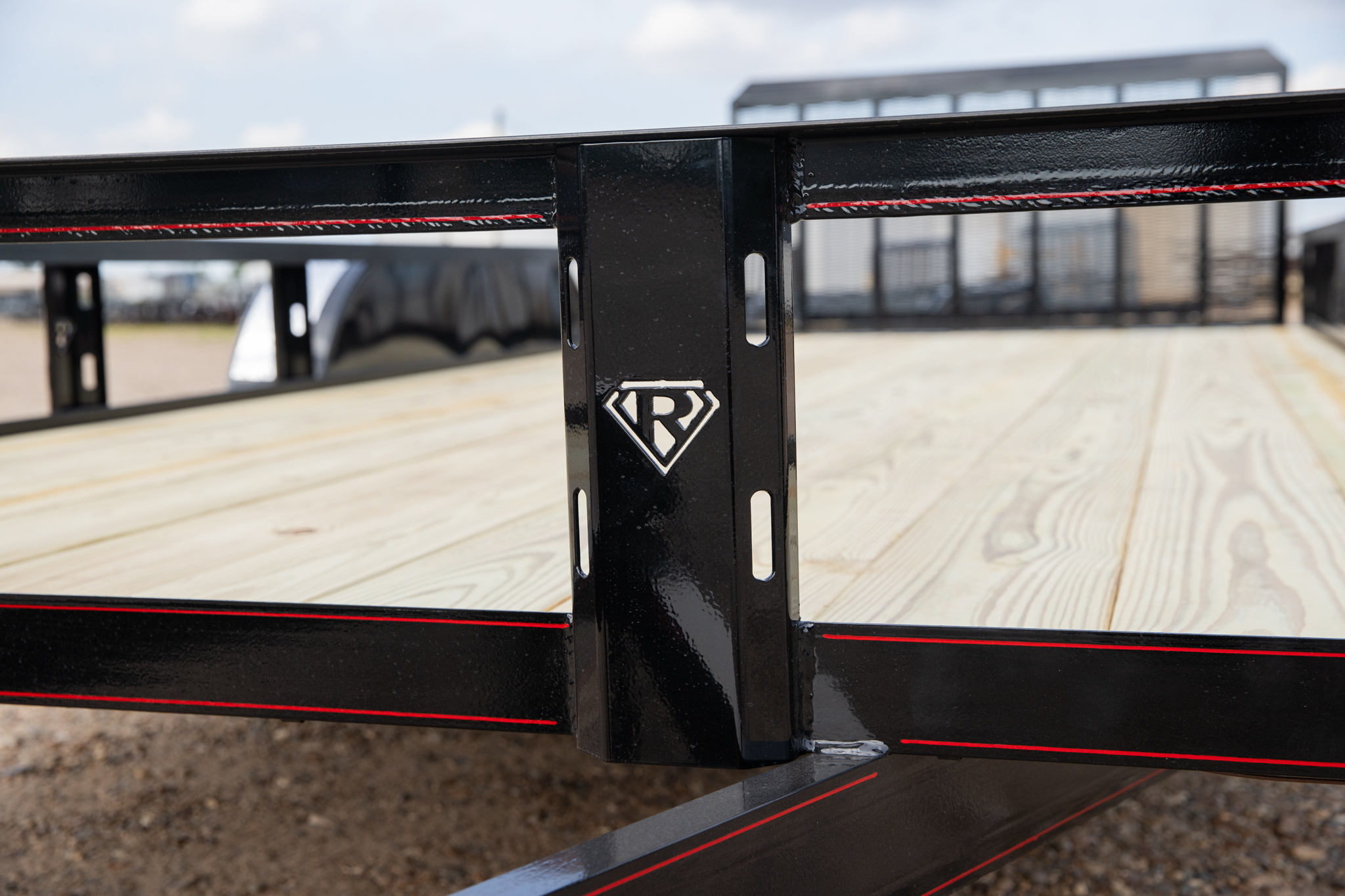 Black Retco utility trailer with the new upright system, front three-quarter view at the Retco facility