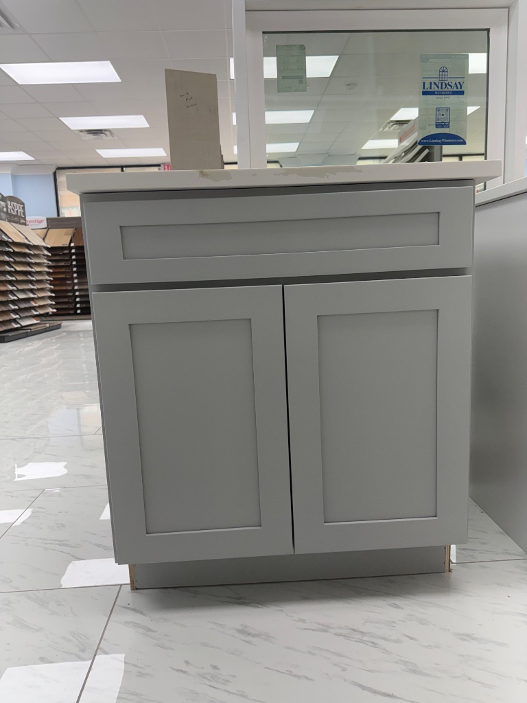 Grey single vanity with quartz countertop