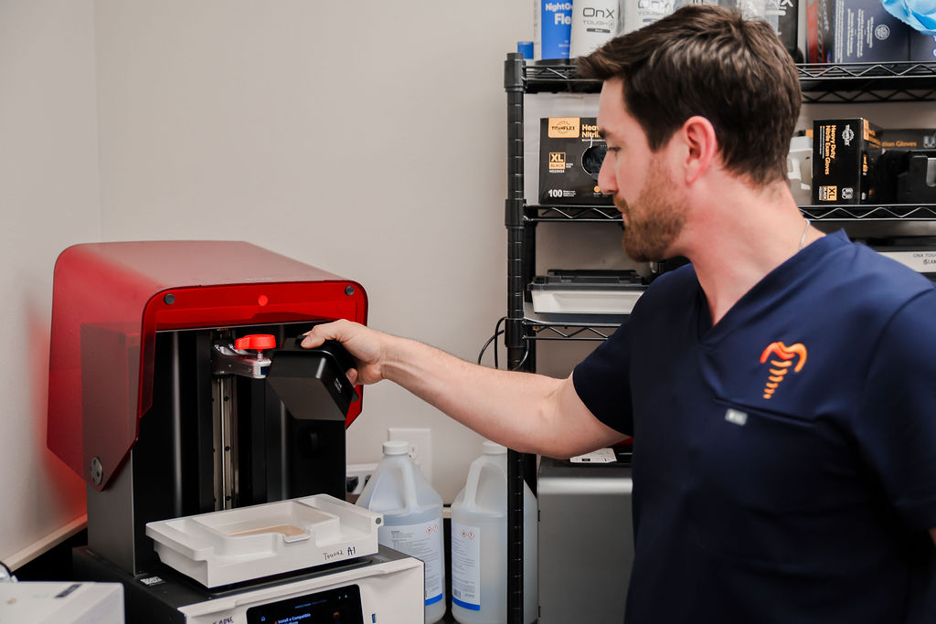Lab technician operating 3D printer