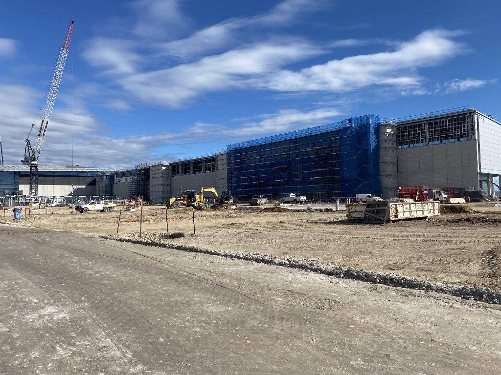 Large construction site with crane and earthworks