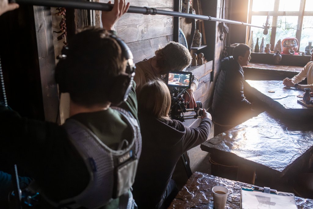 Behind the scenes — crew filming at the table