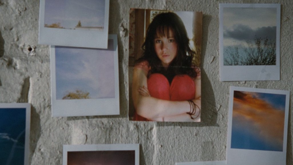 Polaroids on a wall — M's identity