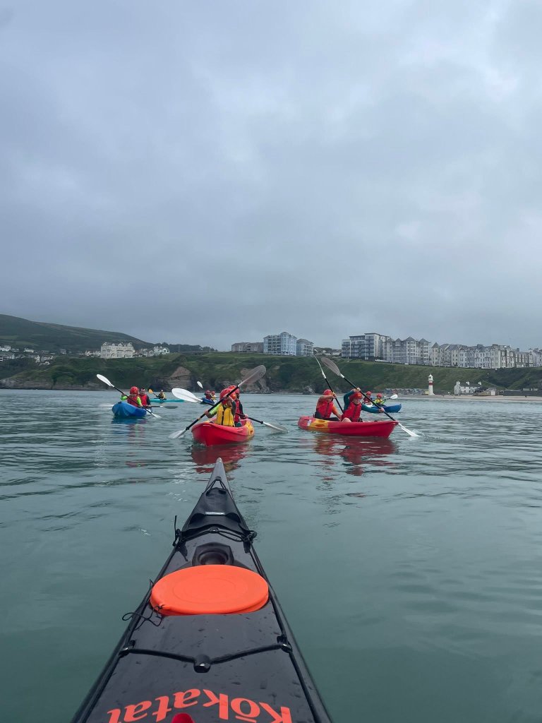 Scout kayaking on the sea