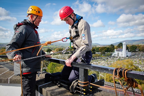 Scout abseiling with instructor